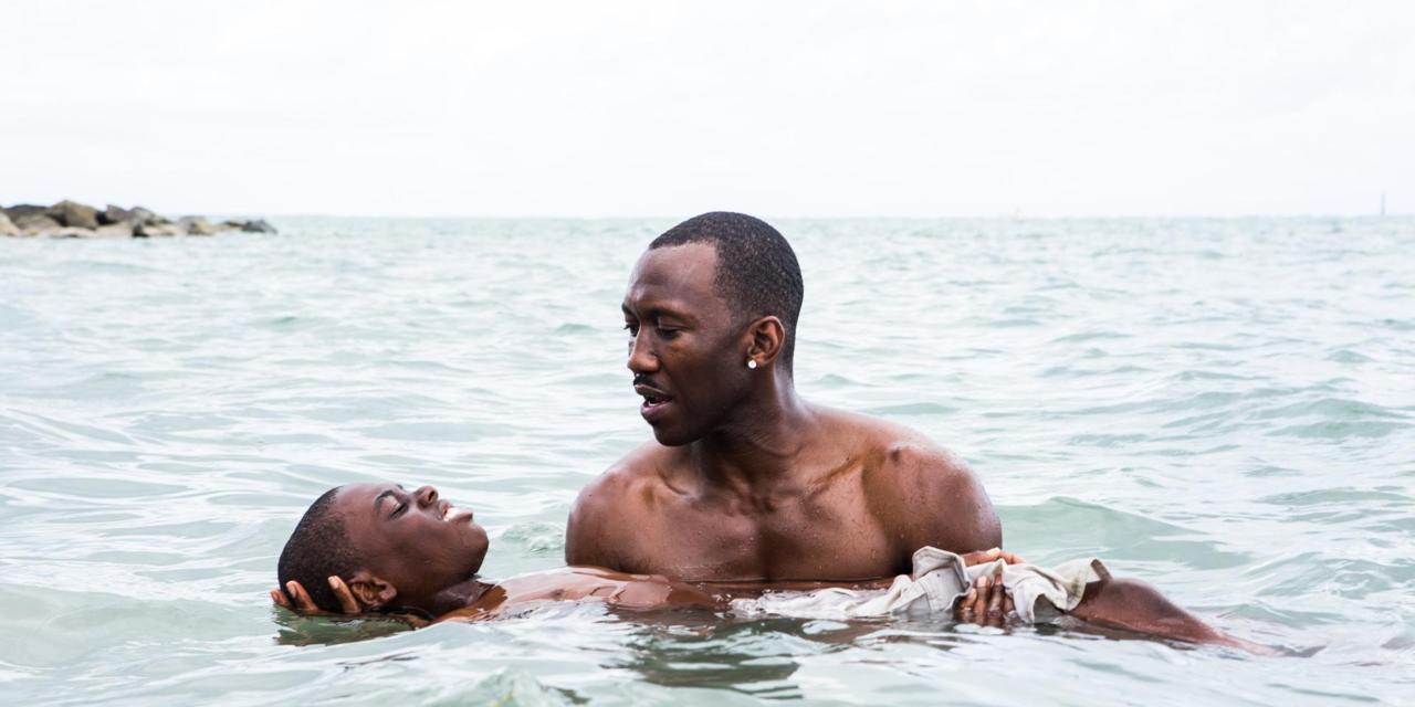 This image released by A24 Films shows Alex Hibbert, left, and Mahershala Ali in a scene from the film, "Moonlight." The film is a poetic coming-of-age tale told across three chapters about a young gay black kid growing up in a poor, drug-ridden neighborhood of Miami. (David Bornfriend/A24 via AP)