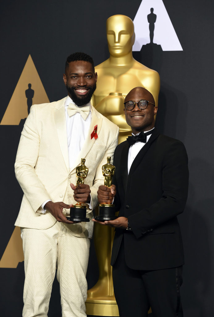 Tarell Alvin McCraney, left, and Barry Jenkins, winners of the award for best adapted screenplay for "Moonlight", pose in the press room at the Oscars on Sunday, Feb. 26, 2017, at the Dolby Theatre in Los Angeles. (Photo by Jordan Strauss/Invision/AP)