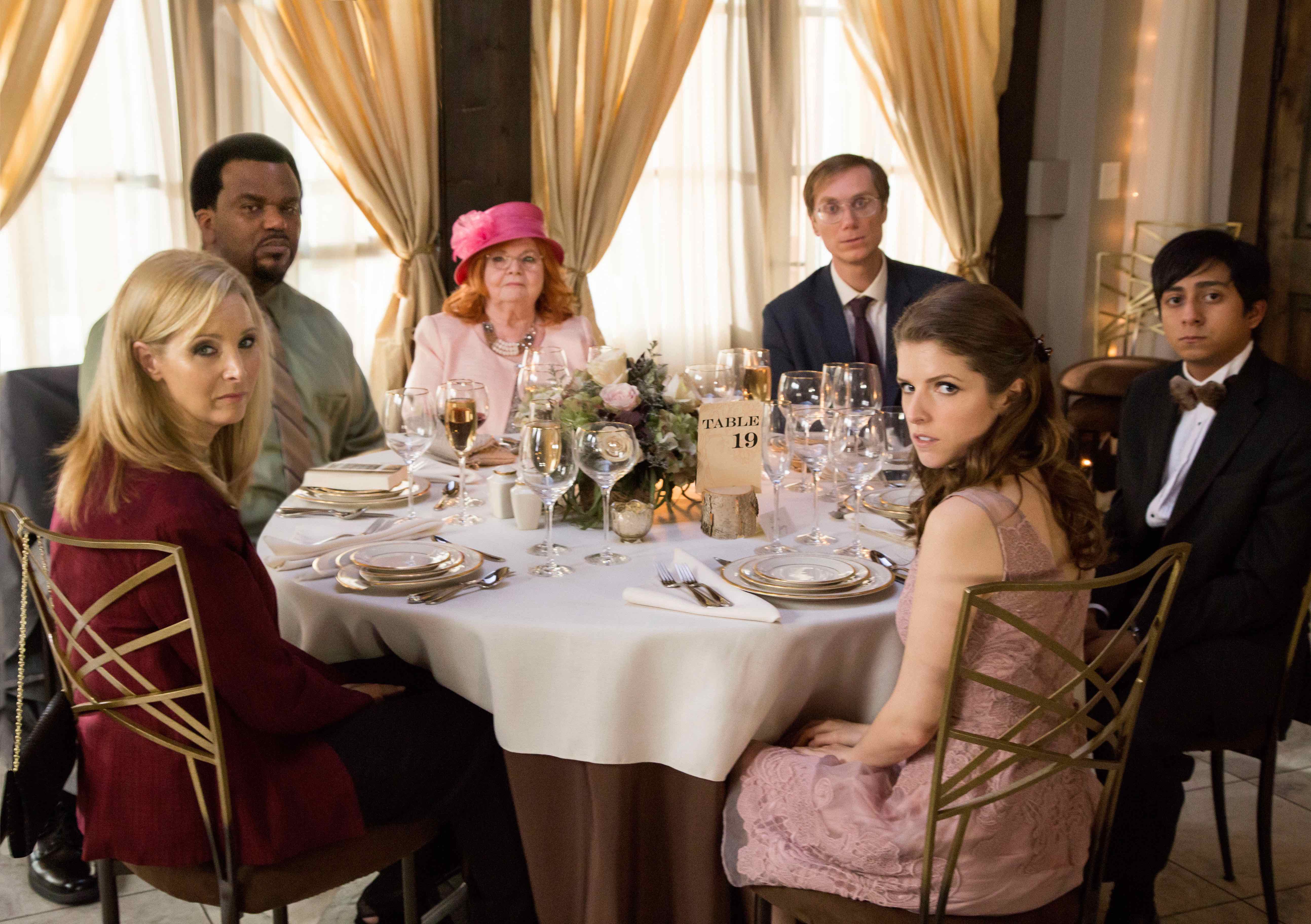 (From L-R): Lisa Kudrow as "Bina," Craig Robinson as "Jerry," June Squibb as "Jo," Stephen Merchant as "Walter," Anna Kendrick as "Eloise," and Tony Revolori as "Renzo" in TABLE 19. Photo by Jace Downs. © 2017 Twentieth Century Fox Film Corporation
